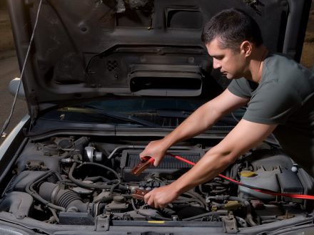 Man changing Costco car Battery