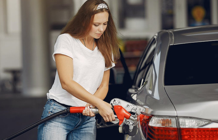 Buying A Diesel Car - Woman Fueling Car- Daily car Blog