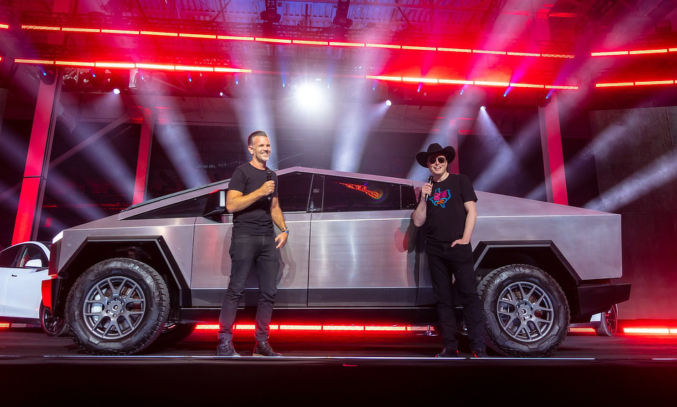 Elon Musk standing next to the Tesla Cybertruck 2022