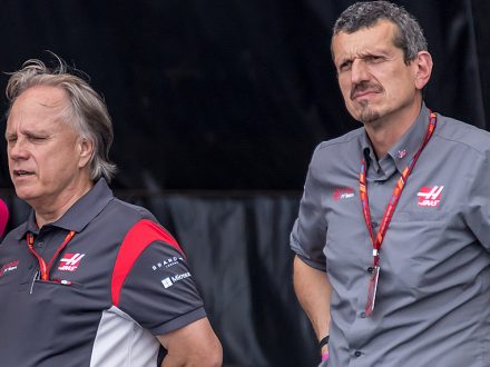 Gene Haas with his back to Guenther Steiner