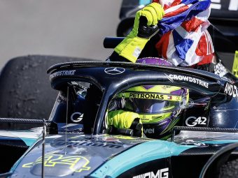 2024 British Grand Prix - Lewis Hamilton waves the British flag on his slow down lap.