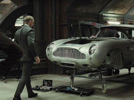 James Bond - Craig Daniel - Looking at the Aston Martin DB5 which is mounted on a repair station