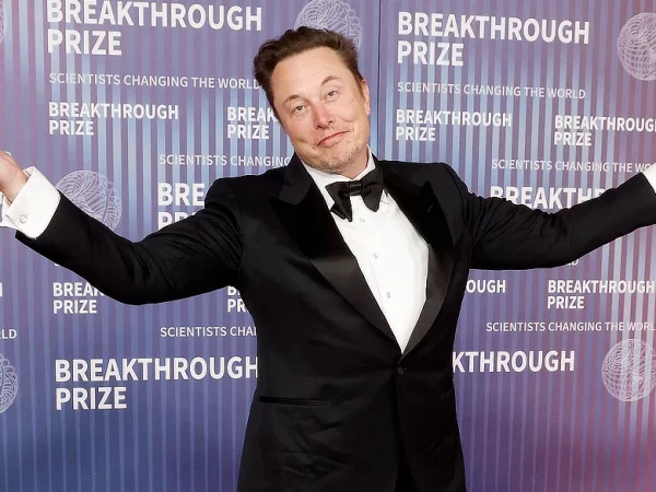Elon Musk shrugging his shoulders
