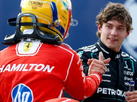 Kimi Antonelli being congratulated by Lewis Hamilton after securing Pole Position for the 2026 British Grand Prix