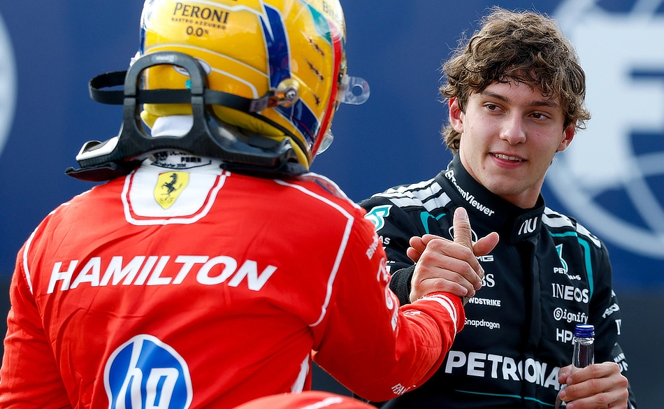 Kimi Antonelli being congratulated by Lewis Hamilton after securing Pole Position for the 2026 British Grand Prix